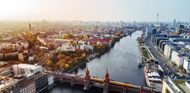 Aerial view of Berlin with view of Oberbaum bridge and yellow U-bahn on sunny autumn day